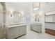 Bright bathroom featuring dual vanities with marble countertops and stylish herringbone tile flooring at 970 Drewry Ne St, Atlanta, GA 30306