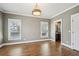 Bedroom with hardwood flooring, windows, and an ensuite bathroom at 970 Drewry Ne St, Atlanta, GA 30306