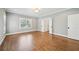 Large bedroom with hardwood floors, two windows, and neutral paint at 970 Drewry Ne St, Atlanta, GA 30306