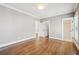 Light-filled bedroom with hardwood floors, white trim and neutral gray walls at 970 Drewry Ne St, Atlanta, GA 30306