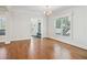 Bright entry area with hardwood floors, large window, mudroom and a chandelier at 970 Drewry Ne St, Atlanta, GA 30306