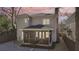 Back of home featuring a screened patio and a brick chimney at 970 Drewry Ne St, Atlanta, GA 30306