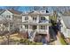 Attractive two-story home with a porch, second story balcony, well-manicured landscaping, and mature trees at 970 Drewry Ne St, Atlanta, GA 30306