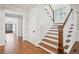 Hallway with hardwood floors, natural light, and staircase to the second floor at 970 Drewry Ne St, Atlanta, GA 30306