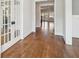 View of a hallway featuring hardwood floors, white trim, and multiple doorways leading to other rooms at 970 Drewry Ne St, Atlanta, GA 30306