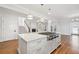 A modern kitchen boasting an island with a built-in cooktop and stylish pendant lighting at 970 Drewry Ne St, Atlanta, GA 30306