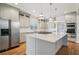 A gourmet kitchen featuring stainless steel appliances, a large island, and custom cabinetry at 970 Drewry Ne St, Atlanta, GA 30306