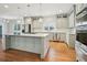 Spacious kitchen with a large center island, stainless steel appliances, and modern light fixtures at 970 Drewry Ne St, Atlanta, GA 30306