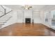 Spacious living room featuring a fireplace with custom built-ins and elegant hardwood flooring at 970 Drewry Ne St, Atlanta, GA 30306