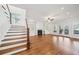 Inviting living room with wood floors, built-in shelving, fireplace, and staircase access at 970 Drewry Ne St, Atlanta, GA 30306