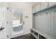 A practical mudroom offers storage with hooks, cubbies, and a bench, convenient to the entry door at 970 Drewry Ne St, Atlanta, GA 30306