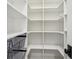 Walk-in pantry featuring custom shelving and storage baskets at 970 Drewry Ne St, Atlanta, GA 30306