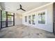 Outdoor patio featuring stone floors, white trim and a ceiling fan at 970 Drewry Ne St, Atlanta, GA 30306