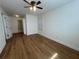 Bedroom with a ceiling fan, hardwood floors, and a well-lit room at 1039 Whitfield Se Ct, Smyrna, GA 30080