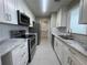 Modern kitchen featuring white cabinets, stainless steel appliances, and granite countertops at 1039 Whitfield Se Ct, Smyrna, GA 30080