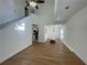 Bright living room featuring hardwood floors, white walls, and a staircase to the second floor at 1039 Whitfield Se Ct, Smyrna, GA 30080