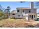 Back exterior view of home with yard and fence at 1267 Huntington Place Cir, Lithonia, GA 30058