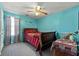 Relaxing bedroom with a wooden bed frame, bedside table and a window at 1267 Huntington Place Cir, Lithonia, GA 30058