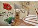 Inviting entryway featuring hardwood floors, staircase, and decorative wall art at 1267 Huntington Place Cir, Lithonia, GA 30058