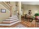 Inviting entryway featuring hardwood floors, staircase, and views into the living room at 1267 Huntington Place Cir, Lithonia, GA 30058