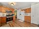 Functional kitchen featuring stainless steel appliances and wood cabinets at 1267 Huntington Place Cir, Lithonia, GA 30058