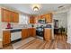 Functional kitchen with stainless steel appliances, wood cabinets, and modern countertops at 1267 Huntington Place Cir, Lithonia, GA 30058