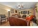 Comfortable living room with hardwood floors, ceiling fan, and decorative fireplace at 1267 Huntington Place Cir, Lithonia, GA 30058