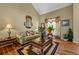 Cozy living room with a large window, comfortable seating, and stylish decor at 1267 Huntington Place Cir, Lithonia, GA 30058