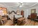 Elegant main bedroom featuring tray ceiling, and comfortable furniture at 1267 Huntington Place Cir, Lithonia, GA 30058