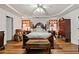 Elegant main bedroom featuring tray ceiling, and comfortable furniture at 1267 Huntington Place Cir, Lithonia, GA 30058