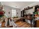 Home office with a wooden desk, piano, shelves, and a comfortable daybed at 1267 Huntington Place Cir, Lithonia, GA 30058