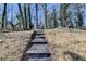 Landscaped backyard featuring stone steps, blending natural beauty with practical design at 2767 3Rd Sw Ave, Atlanta, GA 30315