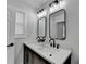 Bathroom features a double sink vanity with herringbone wood accents and matte black hardware at 2767 3Rd Sw Ave, Atlanta, GA 30315