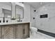 Modern bathroom features double sinks, walk-in shower with black hardware and white marble walls at 2767 3Rd Sw Ave, Atlanta, GA 30315