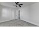 This bedroom features neutral walls, gray carpet and a ceiling fan with a light at 2767 3Rd Sw Ave, Atlanta, GA 30315