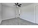 This bedroom features neutral walls, gray carpet and a ceiling fan with a light at 2767 3Rd Sw Ave, Atlanta, GA 30315