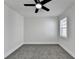 This bedroom features neutral walls, gray carpet and a ceiling fan with a light at 2767 3Rd Sw Ave, Atlanta, GA 30315