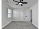 This bedroom features neutral walls, gray carpet and a ceiling fan with a light at 2767 3Rd Sw Ave, Atlanta, GA 30315