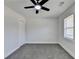 This bedroom features neutral walls, gray carpet, a ceiling fan and a closet at 2767 3Rd Sw Ave, Atlanta, GA 30315