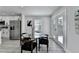 Dining area with modern table, four chairs, access to backyard and view into the newly renovated kitchen at 2767 3Rd Sw Ave, Atlanta, GA 30315