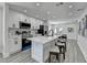 Modern kitchen with stainless steel appliances, white cabinetry, and an island with seating at 2767 3Rd Sw Ave, Atlanta, GA 30315