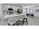 Well-lit kitchen featuring a quartz island, sleek appliances, and white cabinets at 2767 3Rd Sw Ave, Atlanta, GA 30315