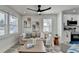 Living room with wood floors, white trim, and open to the kitchen at 2767 3Rd Sw Ave, Atlanta, GA 30315