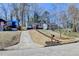 Neighborhood street view of home with a sidewalk and grassy lawn at 2767 3Rd Sw Ave, Atlanta, GA 30315