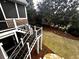 Back deck offers stunning views of the manicured backyard and water fountain with multiple tiers and levels at 2813 Long Grove Ct, Marietta, GA 30062