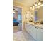 Bathroom featuring white cabinets with double sinks and granite counters, and views of bedroom at 2813 Long Grove Ct, Marietta, GA 30062