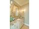 Elegant bathroom with a decorative mirror, granite countertop, and stylish fixtures at 2813 Long Grove Ct, Marietta, GA 30062