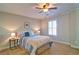 Cozy bedroom with neutral colors, a comfortable bed, and shuttered windows providing natural light at 2813 Long Grove Ct, Marietta, GA 30062