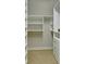 Bright walk-in closet with built-in shelves and drawers for optimal storage at 2813 Long Grove Ct, Marietta, GA 30062