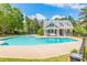 A stunning community pool with ample seating and a nearby pool house at 2813 Long Grove Ct, Marietta, GA 30062